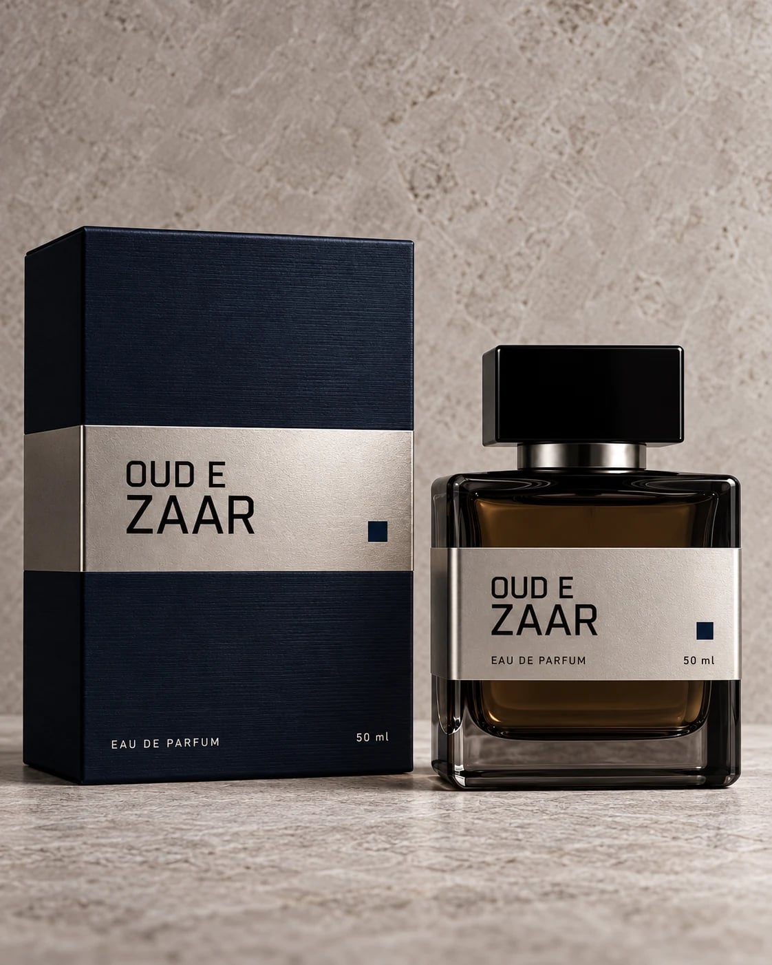 Oud e Zaar 50 ml perfume bottle beside its navy box.